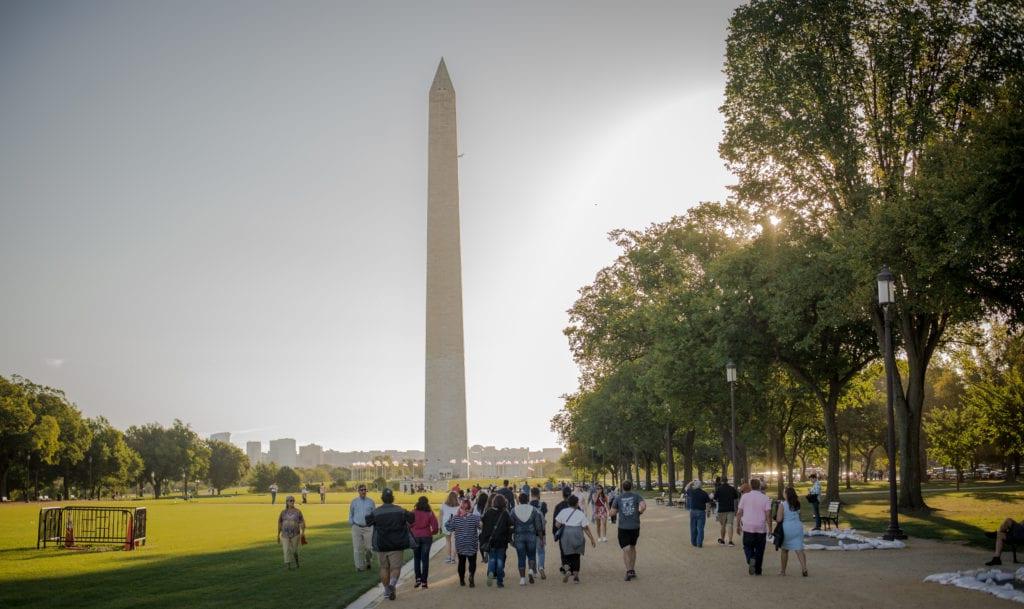Coker Students walking the National Mall, with the Washington Monument in the background.